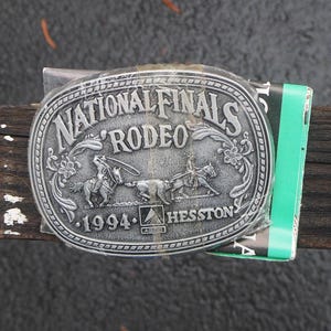 1994 Hesston Rodeo Belt Buckle Miniature or Junior Size National Finals Rodeo Buckles - NOS Still in Wrapper With Information Sheet
