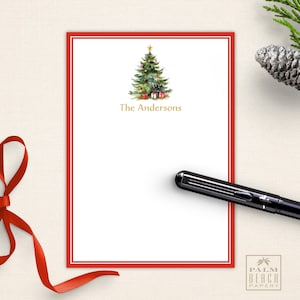 May include: Red and white Christmas stationery with a green Christmas tree illustration and the text "The Andersons".