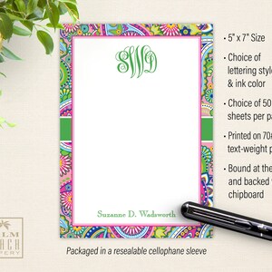 May include: A personalized notepad with a paisley design in pink, green, and blue. The notepad is 5 inches by 7 inches and has a monogram in green. The notepad is packaged in a resealable cellophane sleeve.