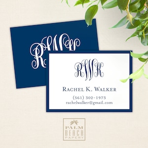 May include: A white monogrammed business card with a navy blue border. The monogram is "R.W.K." and the text reads "Rachel K. Walker", a phone number, and an email address. The card is on a beige background.
