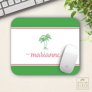 May include: Green and pink personalized mousepad with a palm tree design and the name "marianne" printed in pink cursive.