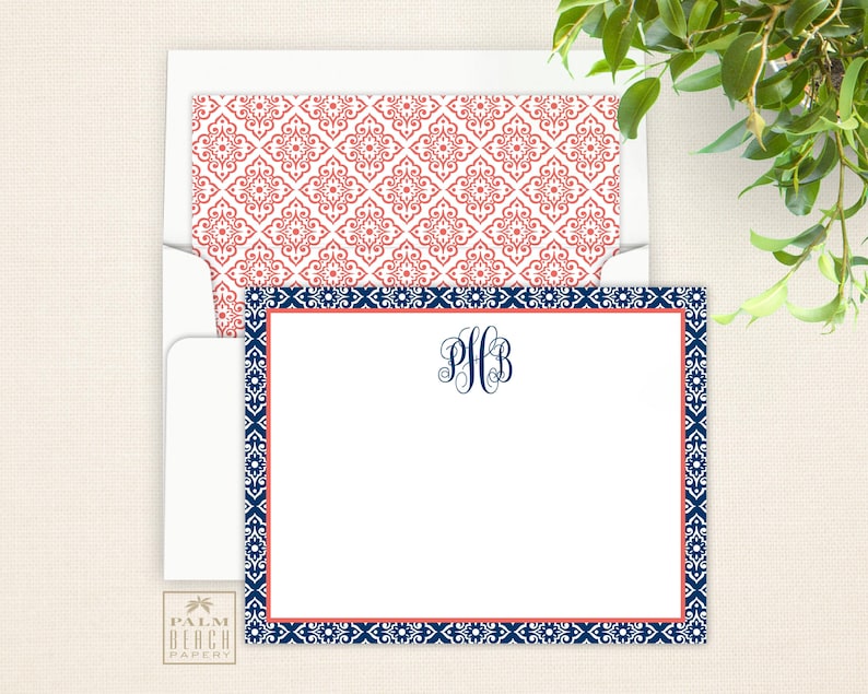 May include: A white card with a blue and coral border. The card has a navy blue monogram in the center that says "PHB".