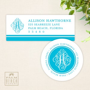 May include: A white rectangular return address label with a blue stripe across the bottom. The label has the text "ALLISON HAWTHORNE, 125 SEABREEZE LANE, PALM BEACH, FLORIDA 33480" in black text. A white round sticker with a blue circle in the center. The blue circle has a white stylized letter "A" in the center. The text "ALLISON HAWTHORNE, 125 SEABREEZE LANE, PALM BEACH, FLORIDA 33480" is around the outside of the blue circle.
