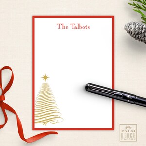 May include: Red and white personalized stationery with a gold Christmas tree design. The stationery says "The Talbots" at the top.