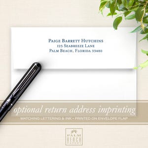 May include: A white envelope with a blue return address printed on the front flap. The address reads "Paige Barrett Hutchins, 125 Seabreeze Lane, Palm Beach, Florida 33480". The envelope is lying flat on a beige surface with a black pen next to it. The text "optional return address imprinting" is printed in brown on a beige background below the envelope. The text "Matching lettering & ink - printed on envelope flap" is printed in brown on a beige background below the previous text. The text "PALM BEACH PAPERY" is printed in brown on a beige background below the previous text.