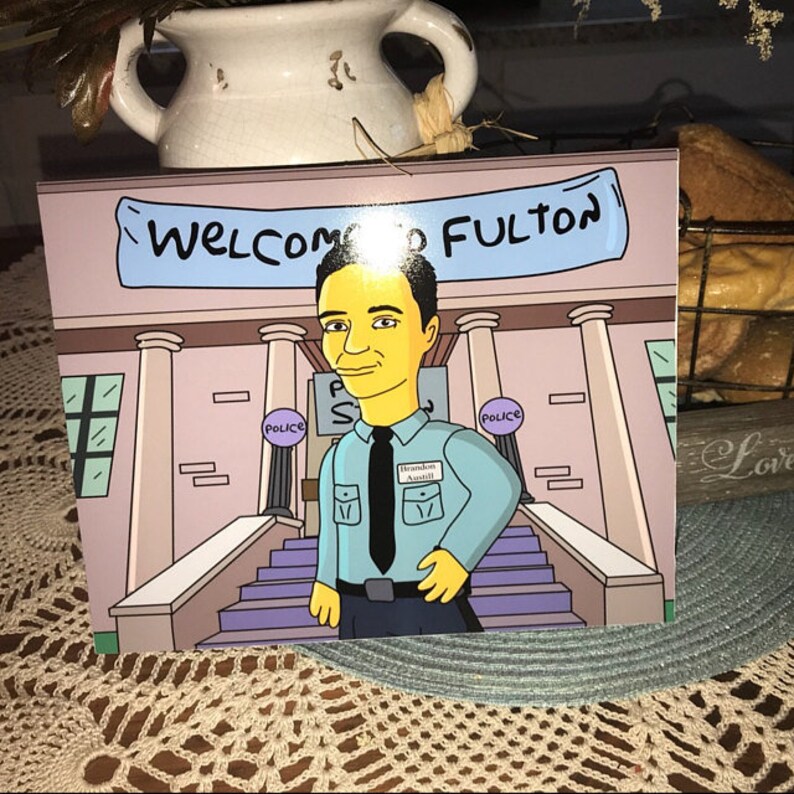 May include: A cartoon illustration of a person with yellow skin and blue hair standing in front of a building with the words "Welcome to Fulton" on a sign above the entrance. The person is wearing a blue shirt with a name tag that says "Brandon Awalt" and a black tie. The building has two police signs on the sides.