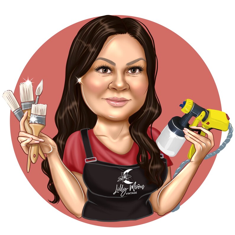 May include: A woman with long brown hair is holding paintbrushes and a spray paint gun. She is wearing a red shirt and a black apron with the text "Lilly Moon Vintage".