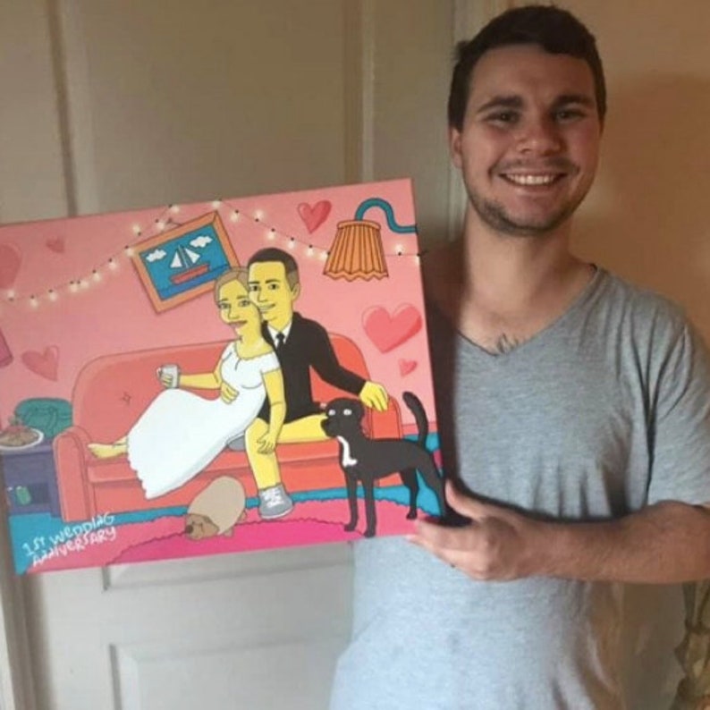 May include: A custom-made painting of a couple in a cartoon style, sitting on a couch with a dog. The painting is on a canvas and has a pink background with hearts and string lights. The text "1st Wedding Anniversary" is at the bottom of the painting.