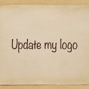 May include: A beige piece of paper with the text "Update my logo" written in black ink.
