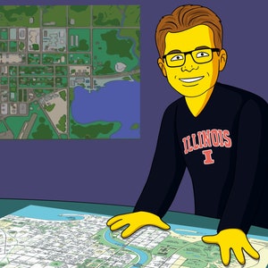 May include: A cartoon illustration of a person wearing a black long-sleeved shirt with the text "ILLINOIS I" in red and white. The person is standing at a table with a large map spread out on the table. The map is a detailed street map of a city.