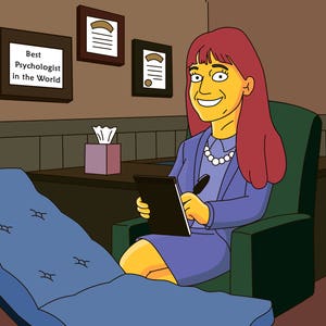May include: A woman with red hair sits in a chair in an office setting. She is wearing a purple blazer and a white pearl necklace. She is holding a black tablet and a pen. There is a couch in the foreground and a sign on the wall that reads "Best Psychologist in the World".