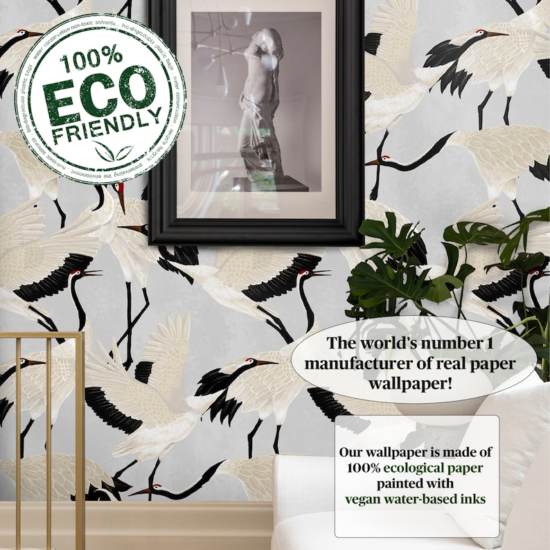 May include: Wallpaper with a repeating pattern of white cranes with black wingtips and red accents on a light grey backdrop. The image includes text that reads "100% ECO FRIENDLY" and "The world's number 1 manufacturer of real paper wallpaper!"