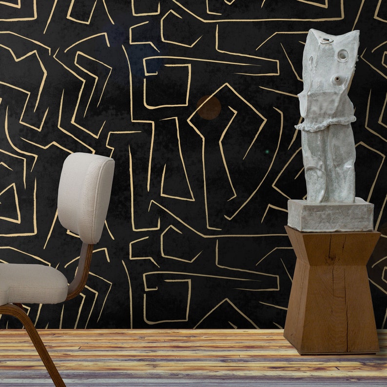 May include: A white ceramic sculpture with an abstract design stands on a wooden pedestal against a black background with gold lines.