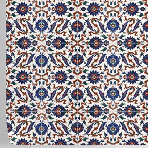 May include: A white tile with a repeating pattern of blue, red, and green floral designs. The tile has a traditional Turkish style.