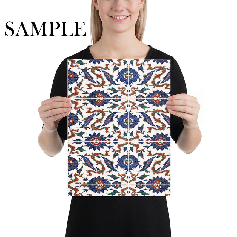 May include: A white poster with a repeating pattern of blue, red, and green floral designs. The pattern is symmetrical and has a traditional Turkish style.