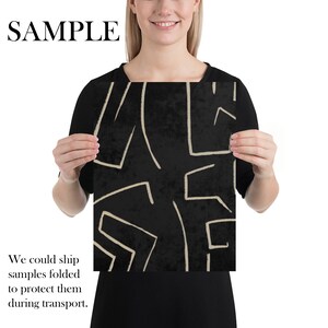 May include: A black and white abstract art print with a geometric pattern of lines and shapes. The print has a textured background and is framed in a white border.