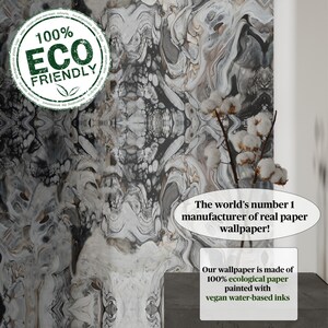 May include: A close-up of a gray and white marbled wallpaper with a black and white swirl pattern. The wallpaper is made of 100% ecological paper and is painted with vegan water-based inks. The text "The world's number 1 manufacturer of real paper wallpaper!" is printed on the image.