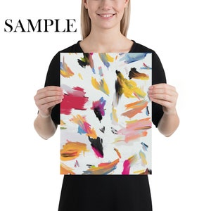 May include: Abstract art print featuring a white background with colorful brushstrokes in shades of yellow, orange, pink, red, blue, and black.