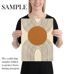 May include: Abstract art print with a large orange circle and black lines on a cream background.