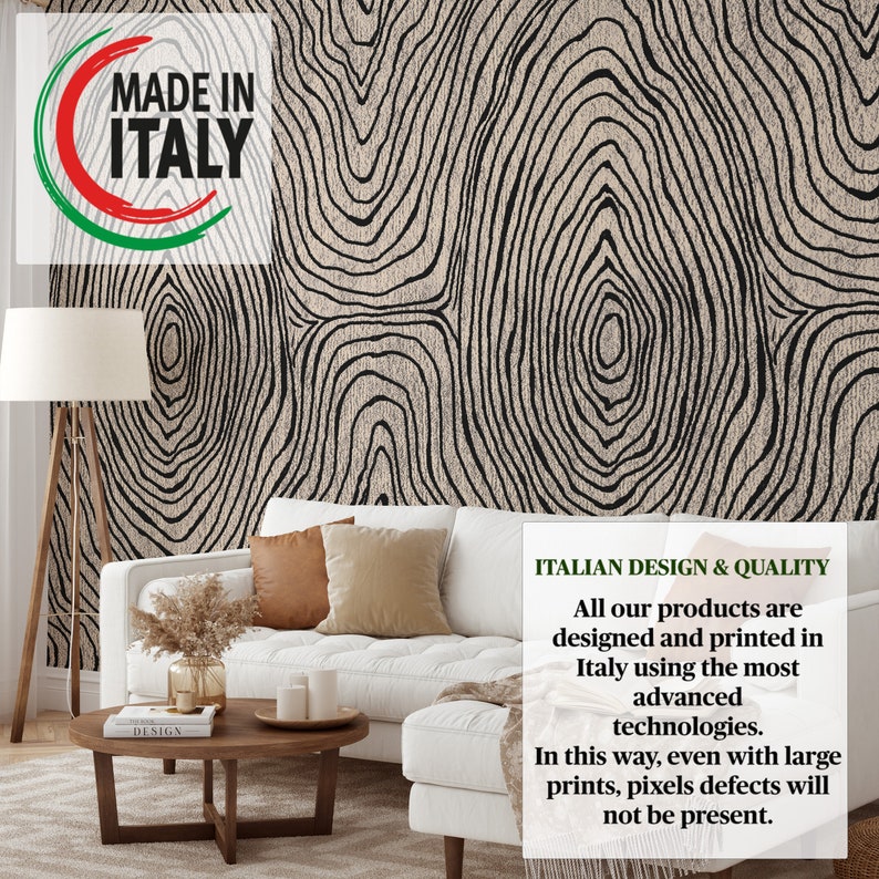 May include: A living room scene featuring a white sofa with brown and beige pillows, a wooden coffee table, and a floor lamp. The wall is covered with wallpaper with a black and beige tree ring design. The text "MADE IN ITALY" is visible.