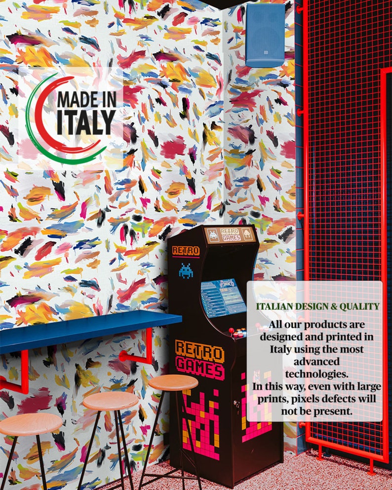 May include: A retro arcade game with a colorful abstract pattern wallpaper in the background. The arcade game has a sign that says "Retro Games". The text "Made in Italy" is visible on the wall.