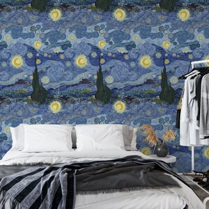 May include: A bedroom with a bed featuring a white duvet and a gray and black striped throw blanket. The wall behind the bed is covered in wallpaper with a blue and yellow swirling pattern reminiscent of Vincent van Gogh's "Starry Night" painting.