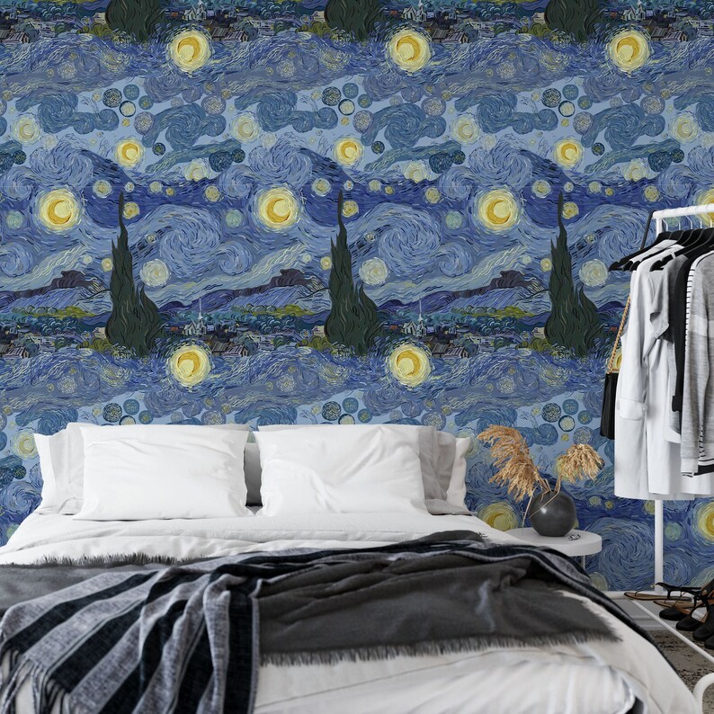 May include: A bedroom with a bed featuring a white duvet and a gray and black striped throw blanket. The wall behind the bed is covered in wallpaper with a blue and yellow swirling pattern reminiscent of Vincent van Gogh's "Starry Night" painting.