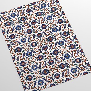 May include: A white tile with a repeating pattern of blue, red, and green floral designs. The pattern is intricate and detailed, with a traditional Turkish style.