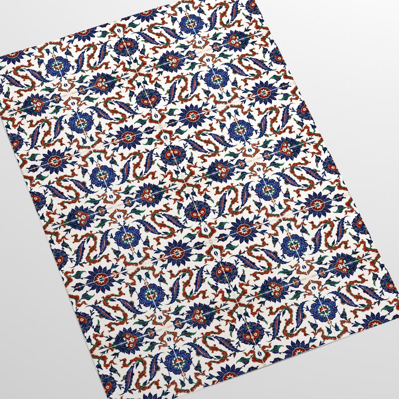 May include: A white tile with a repeating pattern of blue, red, and green floral designs. The pattern is intricate and detailed, with a traditional Turkish style.
