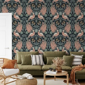 May include: A living room with a green sofa and a patterned wallpaper featuring peacocks in shades of pink, blue, and gold. The wallpaper has a vintage, art nouveau style.