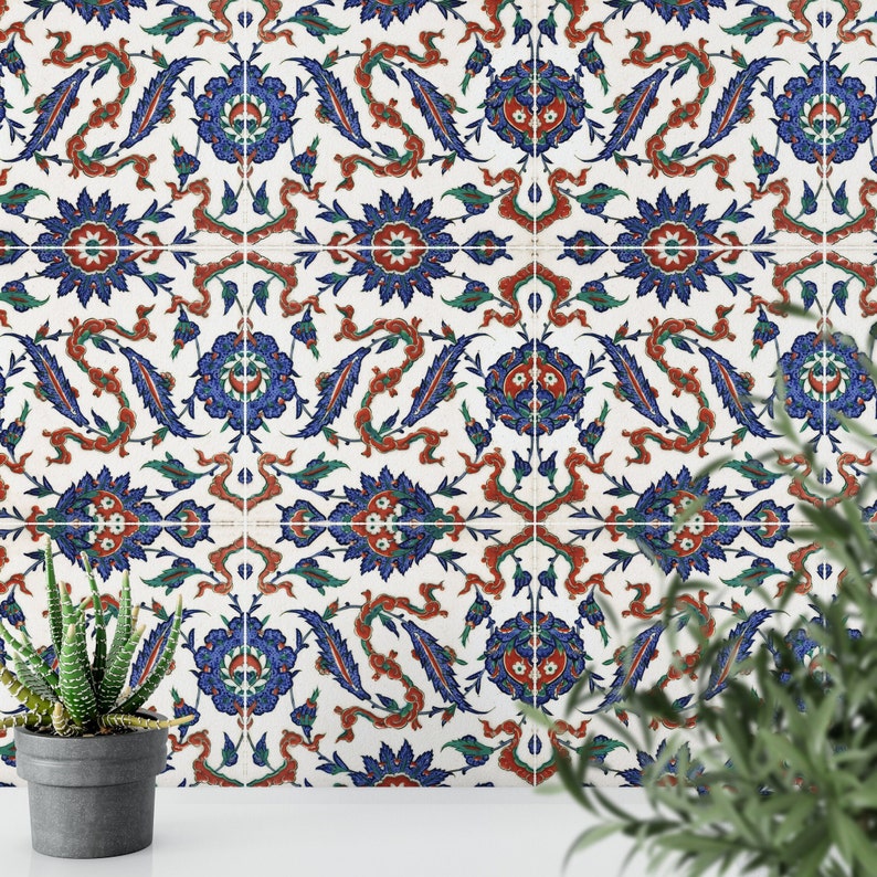 May include: A white background with a repeating pattern of blue, red, and green floral designs. The pattern is reminiscent of traditional Turkish tiles.