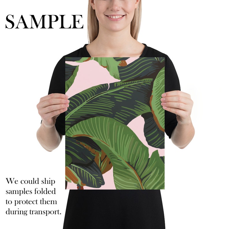 May include: A pink and green tropical leaf print poster. The leaves are large and overlapping, creating a lush and vibrant design.