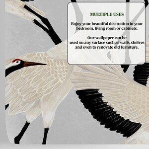 May include: Wallpaper with a detailed illustration of a crane. The crane has cream-colored feathers, black wings and legs, and a red spot on its head. The background is a soft grey. Text on the image says "MULTIPLE USES" and describes where the wallpaper can be used.