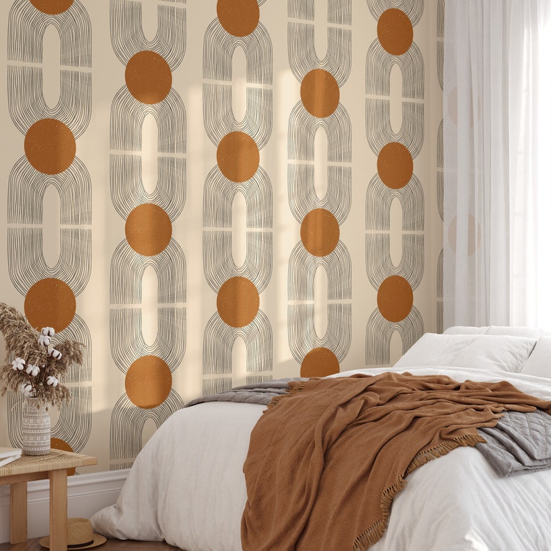 May include: A beige wallpaper with a repeating pattern of brown circles and black lines forming arches. The wallpaper is in a bedroom setting with a white bed and a brown blanket.