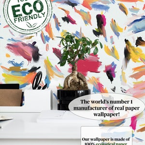 May include: A white background with colorful abstract brushstrokes in shades of pink, blue, yellow, orange, and green. The text "100% ECO FRIENDLY" is in a green circle on the top left corner of the image. The world's number 1 manufacturer of real paper wallpaper! Our wallpaper is made of 100% ecological paper painted with vegan water-based inks.