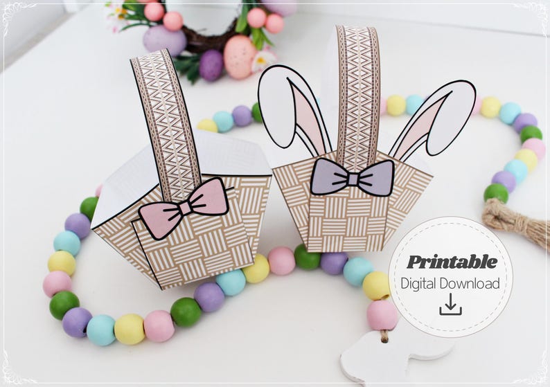 Printable Easter bunny basket template showing two assembled paper baskets with ears and bows