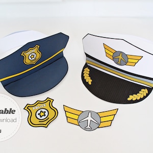 May include: Printable paper hats for a police officer and a pilot. The hats are white with blue and black accents. The police hat has a blue star badge with the word "Police" on it. The pilot hat has a gold airplane wing with a small airplane on it. There are also printable badges for a police officer and a pilot.