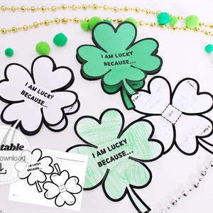 以下が含まれることがあります： 「I AM LUCKY BECAUSE...」のテキストが入った、緑と白のクローバー型の紙工作のコレクション。画像には、印刷可能なデジタルダウンロード、金と銀のビーズ、緑のポンポンが含まれており、聖パトリックの日に最適です。