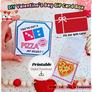 May include: A DIY Valentine's Day gift card box with a pizza theme. The box features the text "You've Got a Pizza My Heart!" and a heart-shaped pizza graphic. Includes a printable digital download.