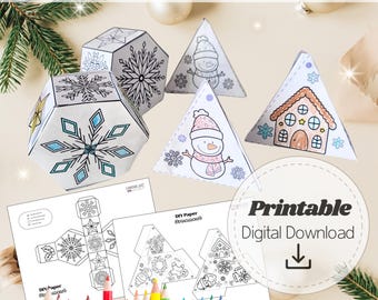May include: DIY 3D paper coloring ornaments. The image shows several white paper ornaments in various shapes, including a snowflake and a snowman. The ornaments are partially colored with blue, pink, and brown. The text "Printable Digital Download" is also visible.