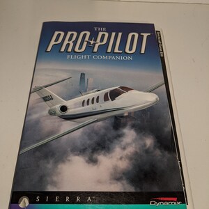 May include: The Pro Pilot Flight Companion book cover. The cover features a white airplane flying over a city skyline. The title is in large, bold, white letters. The Sierra and Dynamix logos are at the bottom.