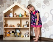 Dolls house with a fireplace.