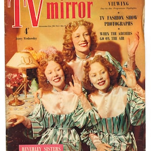 May include: A vintage magazine cover featuring the Beverley Sisters, a trio of singers, in matching green and white striped dresses. The cover is for the November 21st, 1953 issue of "TV Mirror" magazine. The headline reads "TV Fashion Show Photographs" and "When the Archers Go on the Air".