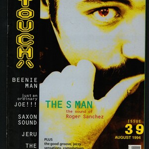 Op de afbeelding: Een tijdschriftcover met een gele en zwarte grafische weergave van het woord "TOUCH" in een vetgedrukt lettertype. De cover toont een close-up van een mannengezicht met één oog zichtbaar. De tekst op de cover luidt "The S Man, the sound of Roger Sanchez". Het tijdschrift heet "Touch" en het nummer is 39, augustus 1994.