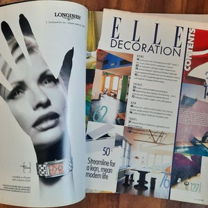 May include: A magazine cover for Elle Decoration featuring a photo of a modern home interior with a sleek, minimalist design. The cover text reads "Elle Decoration" and "Streamline for a lean, mean modern life".