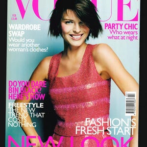 May include: Vogue magazine cover featuring a woman wearing a pink sequined top with the text "Fashion's Fresh Start" and "New Look" in large pink letters.