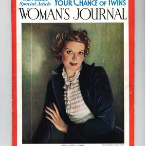 May include: A vintage magazine cover featuring a woman in a dark blue velvet jacket and a white ruffled blouse. The magazine is titled "Woman's Journal" and the cover text reads "This Month's Special Article: Your Chance of Twins".