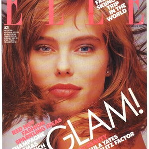 May include: A magazine cover featuring a woman with red hair and a close-up of her face. The magazine is titled "ELLE" and the cover text reads "Glam!" with the tagline "Brilliant Beauty Paula Yates on the Glitz Factor".