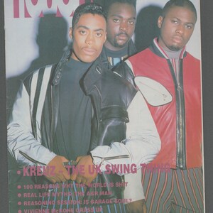May include: A magazine cover with three men posing. The magazine title is "TOUCH" in pink. The cover includes the text "ISSUE 18 AUGUST 1992" and "KREUZ - THE UK SWING THING". The men are wearing jackets, and the background is dark.