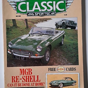 May include: A vintage magazine cover featuring a green MGB roadster with the text "MGB RE-SHELL CAN IT BE DONE AT HOME?" and "CLASSIC LAND-ROVERS". The cover also includes a free Dinky toy car card.